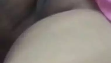 Relaxed Desi aunty lies on the bed with her sweet XXX vagina exposed