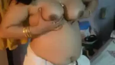 Chubby Desi woman strips naked to show her XXX tits and hairy vagina