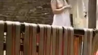 Neighbor can't resist filming porn video when he sees Desi girl undressing