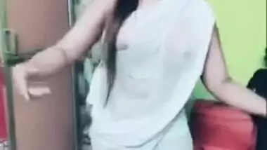 Desi girl in transparent sari dances and sings in short TikTok video