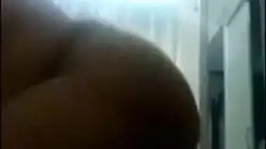 Desi mom with huge melons plays with them on camera in the office