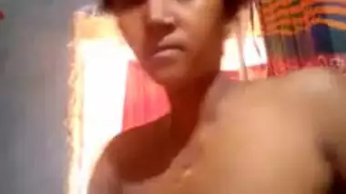 Girl takes boobs to light and touches them in amateur solo sex video