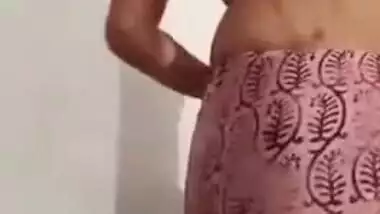 Pleasant Desi girl takes off pink dress in her first porn video