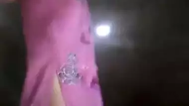 XXX chick with tiny boobs in pink dress gets naked in the shower cabin