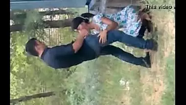 records a young couple enjoying oral sex behind their house