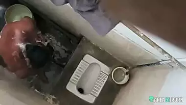 XXX clip of village aunty taking bath in outdoor taken on her son