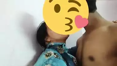 Desi girl in floral shirt kisses porn partner being covered with a smile