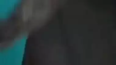 Desi female in a long black skirt exposes legs and boobies in sex show