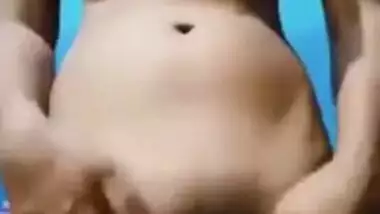 Desi strips down for XXX masturbation in her bedroom with blue walls