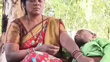 Outdoor sex of a handicapped man with a milf in the jungle