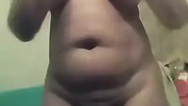 Amateur Indian woman goes in bathroom to show her XXX jugs and muff