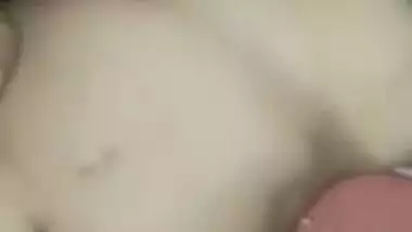 Wife lies on the bed letting the Desi hubby film the porn video