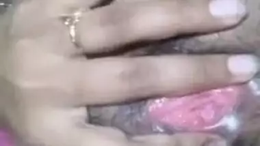 Desi bitch pulls pink dress up to XXX finger her wet hairy pussy