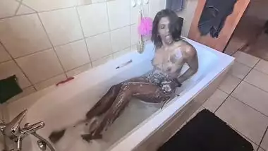 A desi Indian slut giving her dark petite body a sexy steamy bubble bath.