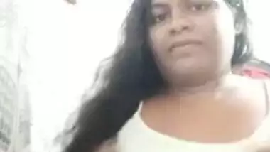 Long-haired Desi hussy takes top off to reveal her big XXX breasts