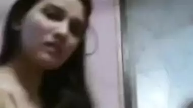 Woman shows XXX boobs before putting a sex bra on in front of Desi cam