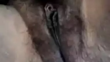 Young village girl spreads legs to rub virgin Desi bush in XXX video