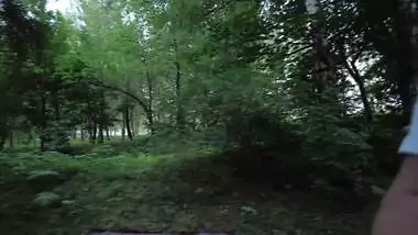 A couple, in plain sight, engaged in extreme sex in a clearing near the road