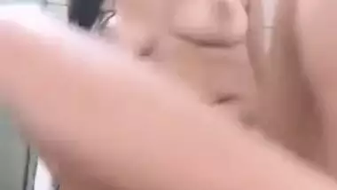 Young Desi minx enjoys taking a shower and records XXX fingering