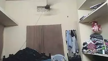 Indian girl wears pink bra and red top on camera in her bedroom