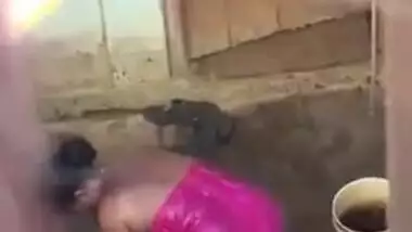 Voyeur can't take eyes off Desi girl taking a XXX shower outdoors