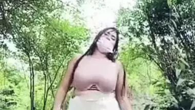 Busty Indian girl is fucked in the forest without taking XXX clothes off