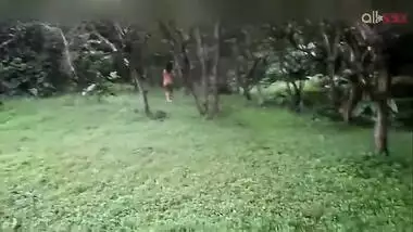 Two hot and sexy Desi aunty bathing in a outdoor under rain together