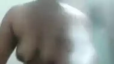 Eccentric Desi MILF takes XXX poses in front of the camera in the nude