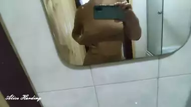Alice takes a selfie and shows her tits and pussy in the shower room