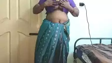 desi indian tamil telugu kannada malayalam hindi horny cheating wife vanitha wearing blue colour saree showing big boobs and shaved pussy press hard b