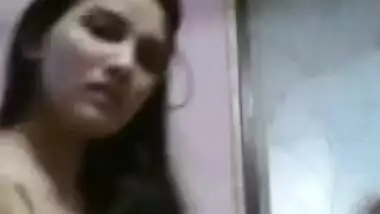 Pretty Desi gal puts on clothes and records this XXX process on cam