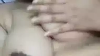 Indian XXX slut demonstrates her sex sized breasts and licks nipples