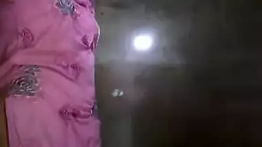 Slinky sex Indian woman takes her clothes off and flashes her XXX tits