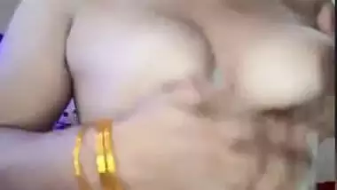 Desi takes sari down a bit to expose her naked XXX assets at home