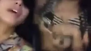 two hot babes flash there boobs and kiss each other in moving car..