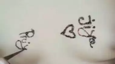 Nude girl puts henna on her naked body during a video call sex