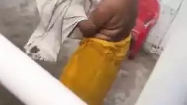 MILF dries hair and body outdoors being filmed by an Indian perv