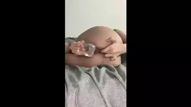 Indian/British slut fingering her asshole and fucking her pussy with a fat 8