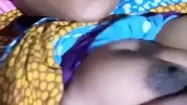 Pretty Desi MILF poses for the camera and teases with big XXX tits